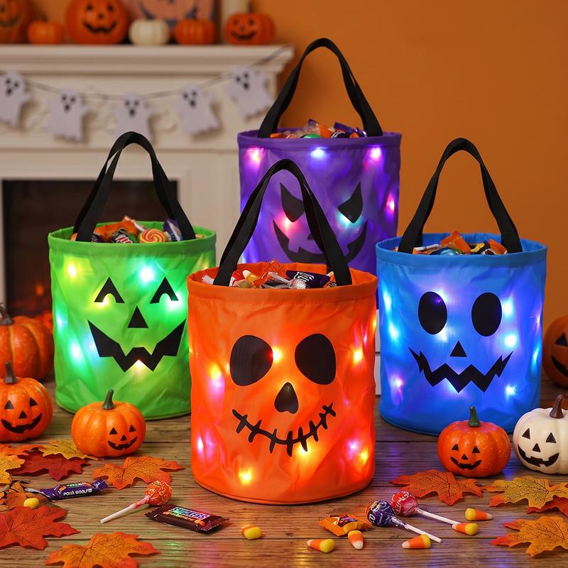 Glowing trick-or-treat bags filled with Halloween candy